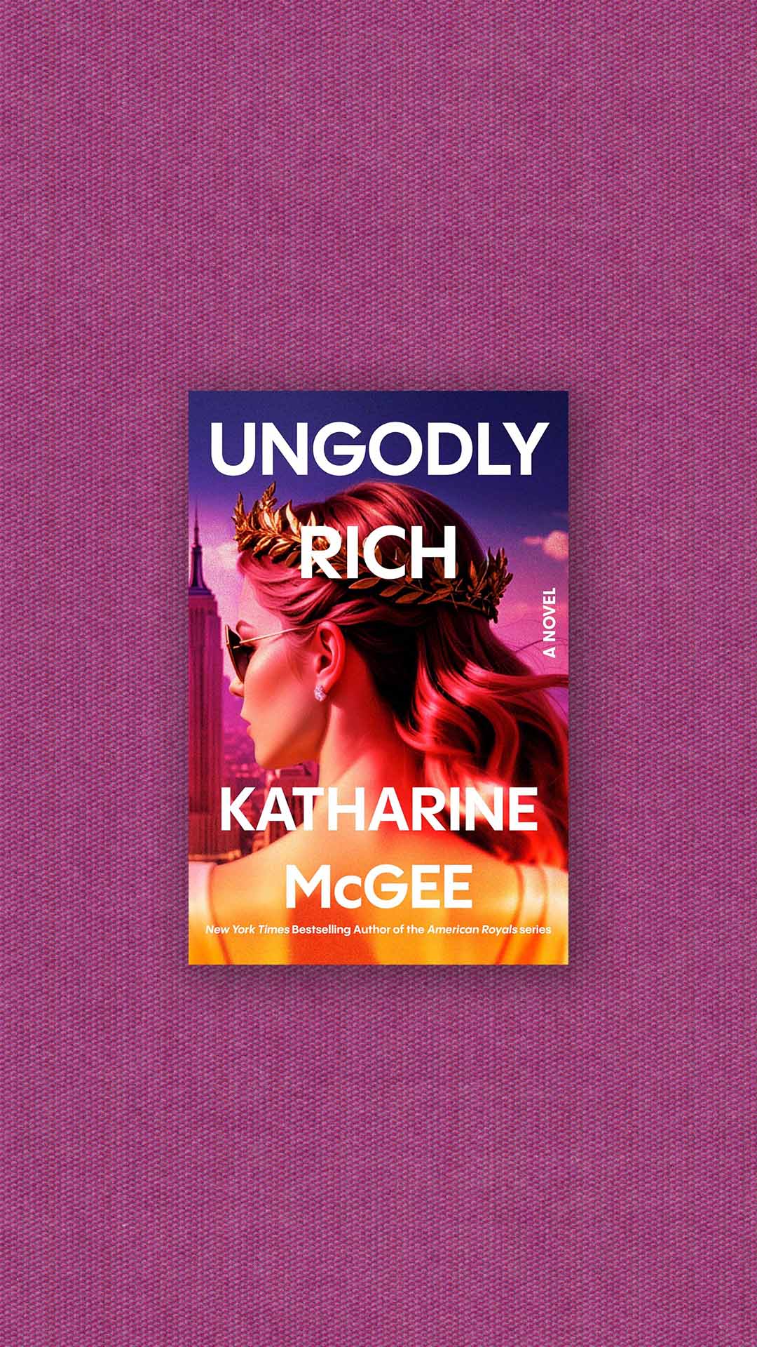The book, Ungodly Rich, on a fuchsia background.